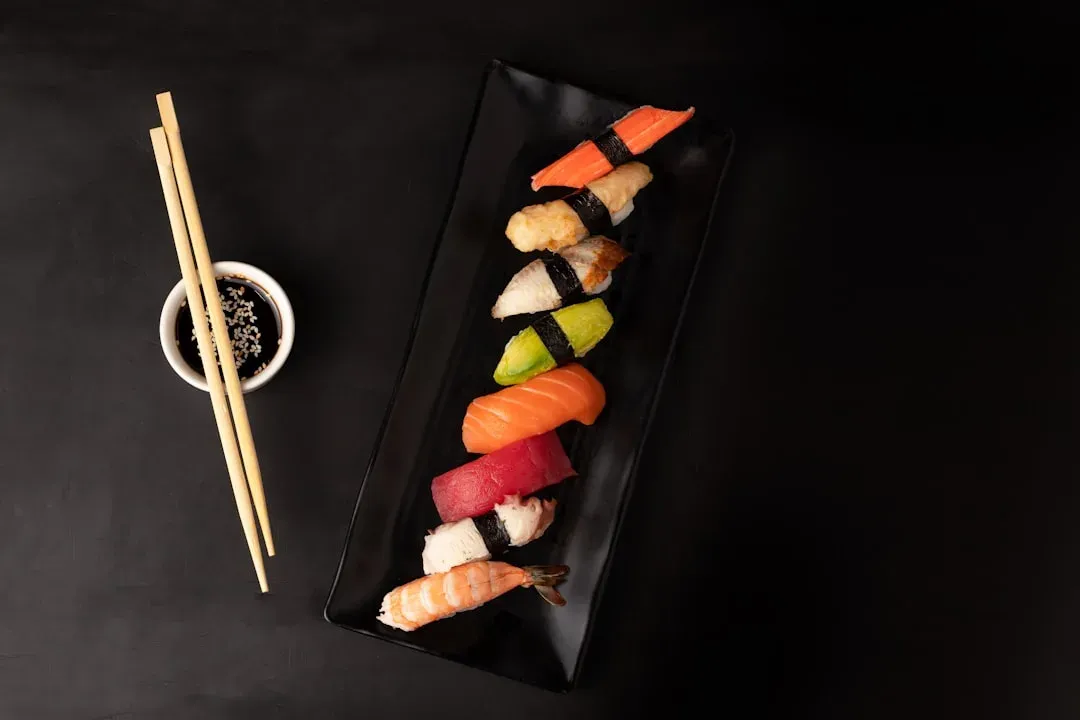 delicious sushi plate with various rolls and garnishes
