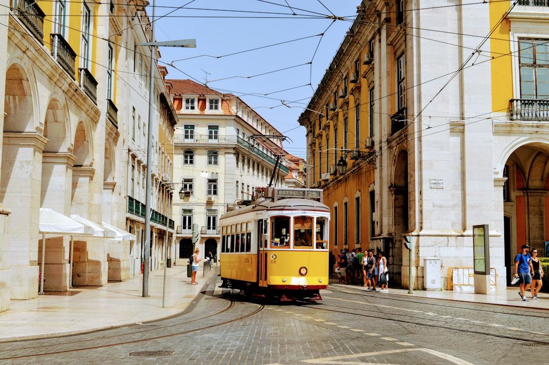 People visiting historic sites and enjoying the vibrant city of Lisbon in May